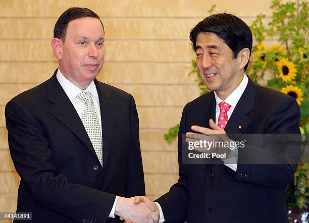 Michael M. Kaiser, President of the Kennedy Center in Washington DC, USA, shakes hands with Japanese Prime Minister Shinzo Abe during a courtesty...