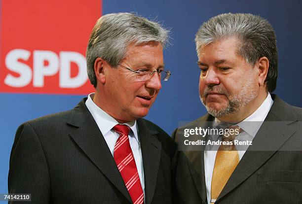 Chairman of the Social Democratic Party Kurt Beck and Bremen's Social Democrat mayor Jens Boehrnsen look on during a news conference on May 14, 2007...