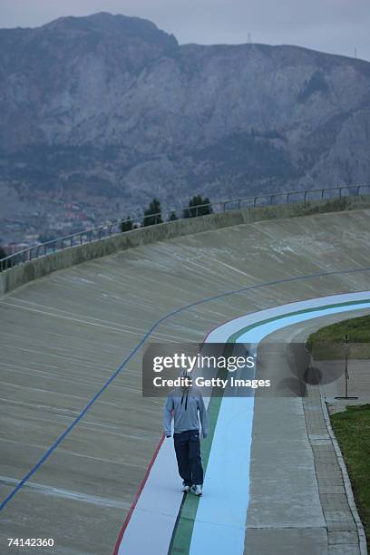 Chris Hoy of Great Britain cuts a lonely figure as he walks around the velodrome early morning in preparations before his failed attempt to break the...