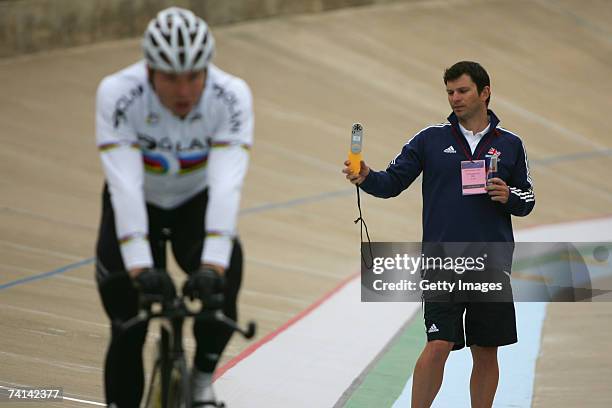 Chris Hoy of Great Britain riding as sports scientist,Scott Gardner measures the wind in preparations before his failed attempt to break the World 1...