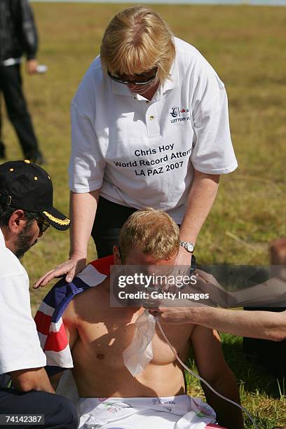 Chris Hoy of Great Britain is administered oxygen and comforted by his mother Carol Hoy after failing in his attempt to break the World 1 Kilometre...