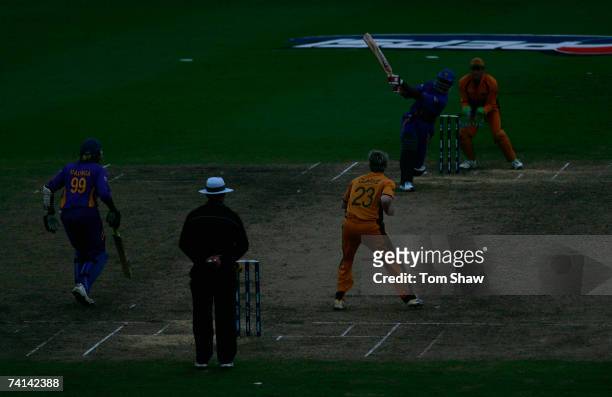 Chaminda Vaas of Sri Lanka hits out in the dark during the ICC Cricket World Cup Final between Australia and Sri Lanka at the Kensington Oval on...