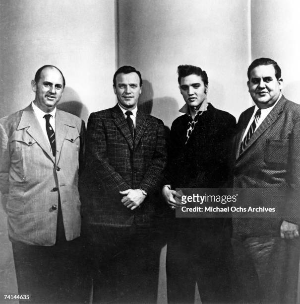 Elvis Presley with Colonel Tom Parker, Eddy Arnold and Steve Sholes at the RCA Recording studios for his last recording session for two years, on...