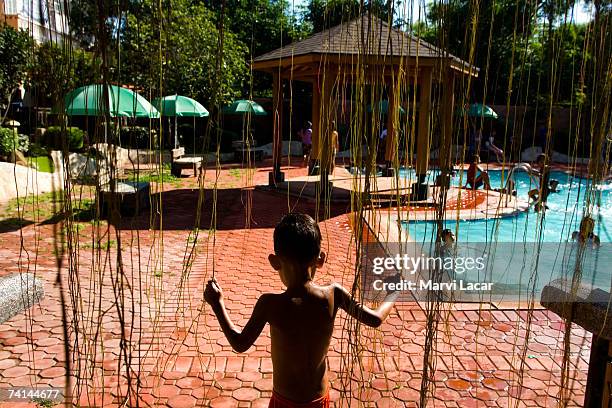 Families deemed by sponsoring NGOs as toxic waste victims spend a day retreat at a public pool, June 1, 2006 in Angeles, Pampanga. The families were...