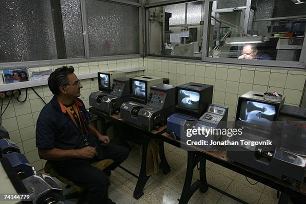 Diamonds are being cut at one of Israel's diamond cutting factories November, 2005 in Ramat-Gan, Israel. Cutting a rough diamond takes great skill. A...