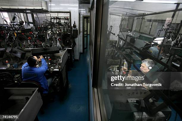 Diamonds are being polished at one of Israel's diamond polishing factories November, 2005 in Ramat-Gan, Israel. After the rough diamonds have been...