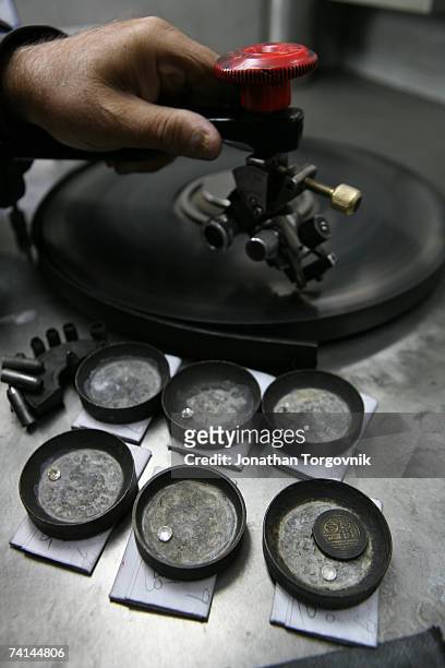Diamonds are being polished at one of Israel's diamond polishing factories November, 2005 in Ramat-Gan, Israel. After the rough diamonds have been...