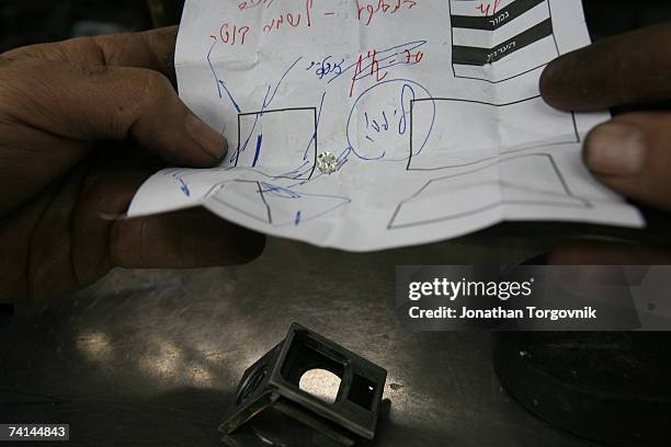 Diamonds prepared to be cut at one of Israel's diamond cutting factories November, 2005 in Ramat-Gan, Israel. Cutting a rough diamond takes great...