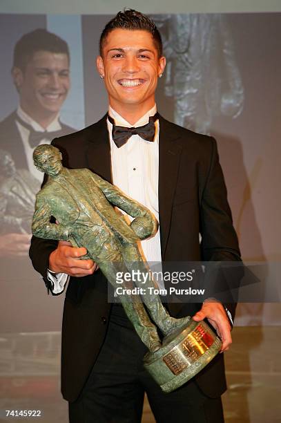 Cristiano Ronaldo of Manchester United poses with his Sir Matt Busby Player of the Year award during the annual Manchester United Players' Player of...