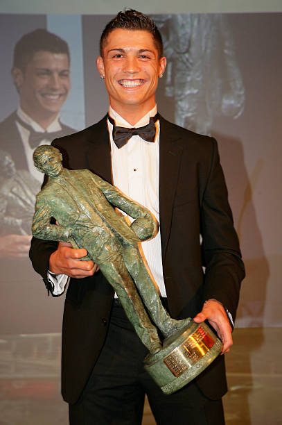 Cristiano Ronaldo of Manchester United poses with his Sir Matt Busby Player of the Year award during the annual Manchester United Players' Player of...