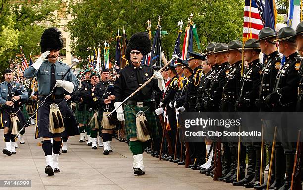 Hundreds of law enforcement bagpipe players march down 6th Street NW during the Twelfth Annual Emerald Society & Pipeband March and Service May 14,...