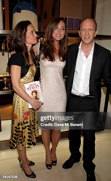 Pippa and Kate Middleton pose with journalist Simon Sebag Montefiore at the book launch party of The Young Stalin: The Adventurous Early Life Of The...