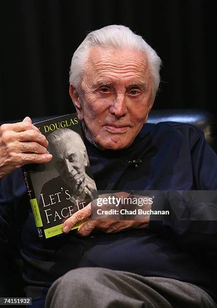 Actor Kirk Douglas poses with his new book Lets Face It at the Kirk Douglas Theater May 14, 2007 in Culver City, California.