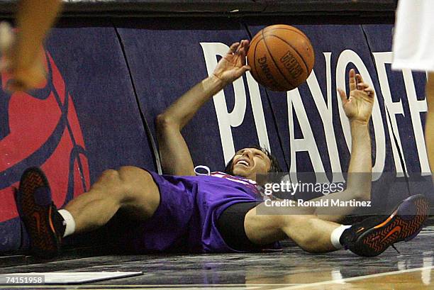 Guard Steve Nash of the Phoenix Suns falls out of bounds after a flagrant foul by Robert Horry of the San Antonio Spurs in Game Four of the Western...