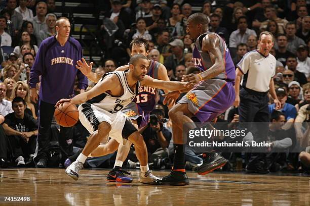 Tony Parker of the San Antonio Spurs drives against Amare Stoudemire of the Phoenix Suns in Game Four of the Western Conference Semifinals during the...