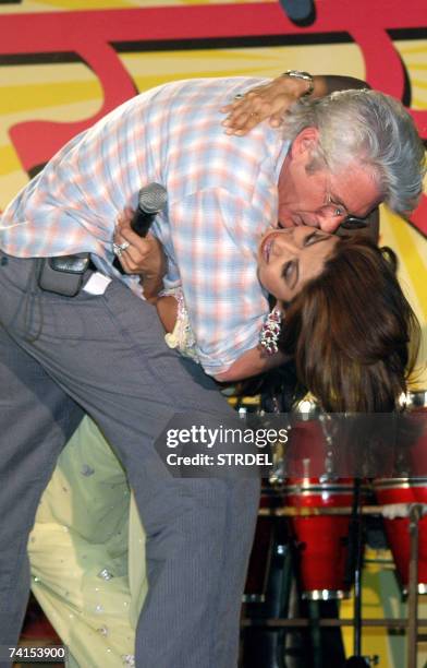 In this file picture taken 15 March 2007, US actor Richard Gere holds Indian actress Shilpa Shetty in a sweeping embrace during and event for...