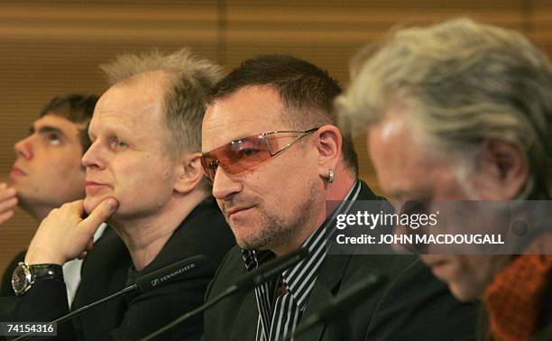 German pop star Herbert Groenemeyer , Irish pop band U2 frontman Bono and Irish political activist Bob Geldof address a press conference following...