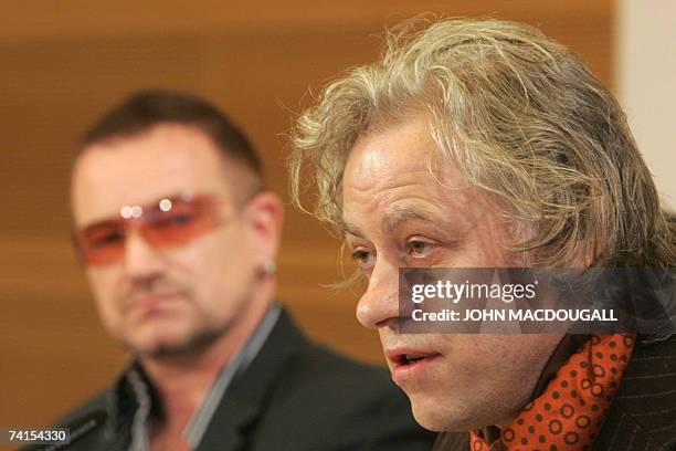 Irish pop band U2 frontman Bono and Irish political activist Bob Geldof address a press conference following the release of the DATA report 2007, 15...