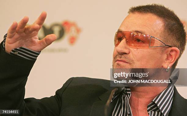 Irish pop band U2 frontman Bono addresses a press conference following the release of the DATA report 2007, 15 May 2007 in Berlin. Bono and Irish...