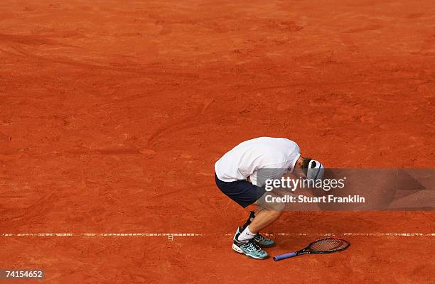 Andrew Murray of Great Britian holds his injured wrist during his match against Filippo Volandri of Italy during day two of the Tennis Masters Series...