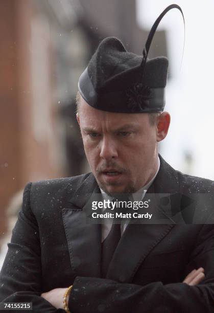 Designer Alexander McQueen arrives for the funeral service for fashion stylist Isabella Blow at Gloucester Cathedral on May 15 2007 in Gloucester...