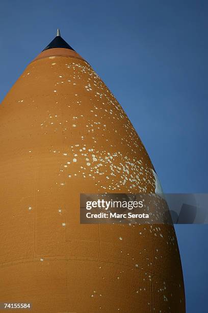 Repairs made to the external tank of the Space Shuttle Atlantis can be seen as ist makes the 3.4-mile journey to launch pad 39A at the Kennedy Space...