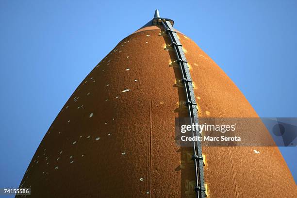 Repairs made to the external tank of the Space Shuttle Atlantis can be seen as ist makes the 3.4-mile journey to launch pad 39A at the Kennedy Space...