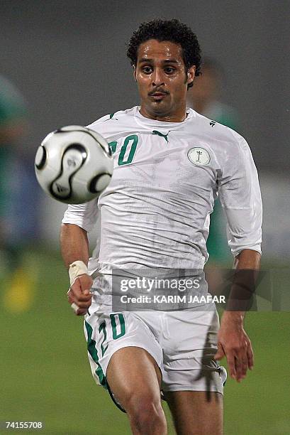 Saudi football team forward Yasser al-Qahtani is seen in action during the 18th Gulf Cup championship against Iraq in the Emirati capital of Abu...