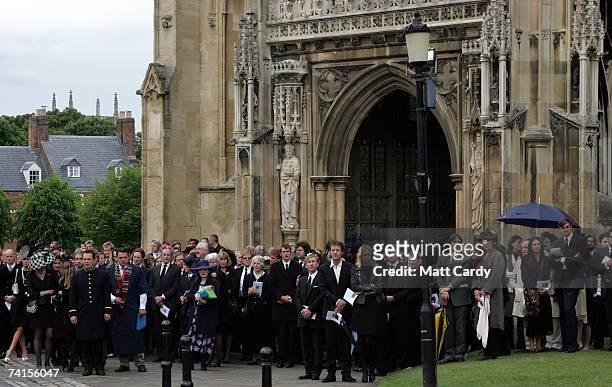 Mourners including Detmar Blow watch as the coffin of fashion stylist Isabella Blow is moved, at Gloucester Cathedral on May 15 2007 in Gloucester...