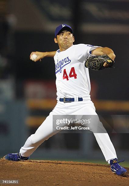 Pitcher Takashi Saito of the Los Angeles Dodgers delivers a pitch en route to saving the game for a 2-0 win against the Cincinnati Reds during their...