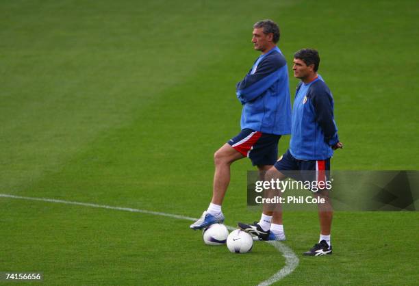 Juande Ramos coach of Sevilla and his assistant Antonio Alvarez Giraldez watch their players during a training session prior to the UEFA Cup Final...