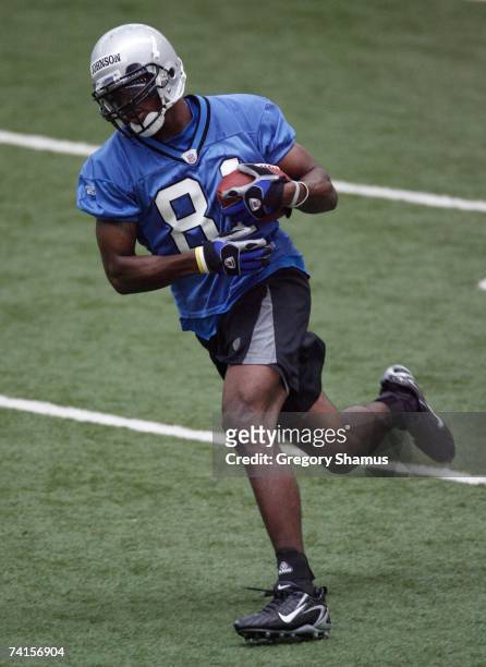 Calvin Johnson of the Detroit Lions runs after making a catch at rookie mini camp at the Detroit Lions Headquarters and Training Facility on May 5,...
