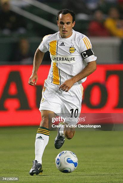 Landon Donovan of the Los Angeles Galaxy dribbles the ball on the attack against the New England Revolution during their MLS match at The Home Depot...