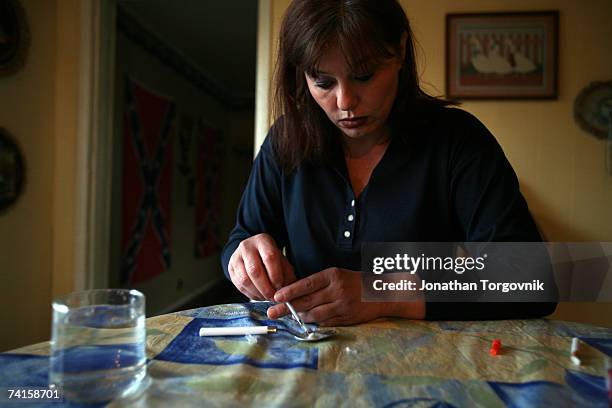 Linda at Sandy's house preparing her Meth to inject on November 30, 2005 in Bowling Green, Kentucky. Right after she shot up the Meth she also shoot...