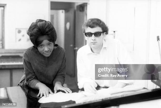 Music producer Phil Spector with Lala Brooks during a recording session in 1964 at Gold Star Studios in Los Angeles, California.