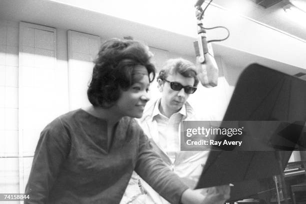 Music producer Phil Spector with Lala Brooks during a recording session in 1964 at Gold Star Studios in Los Angeles, California.