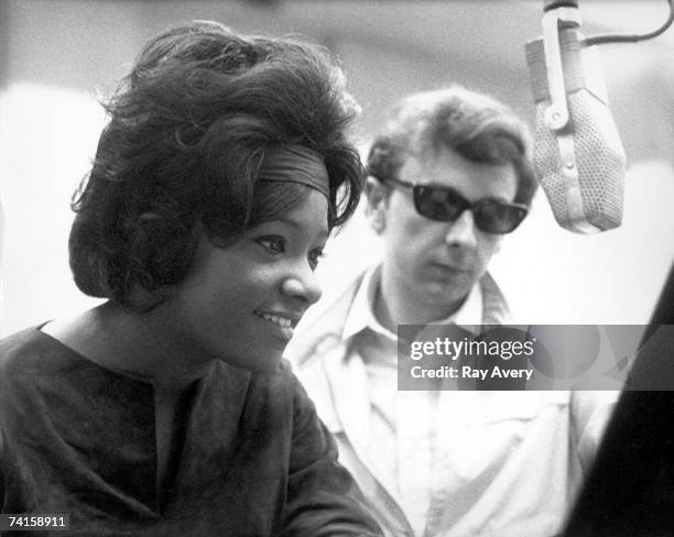 Music producer Phil Spector with Lala Brooks during a recording session in 1964 at Gold Star Studios in Los Angeles, California.