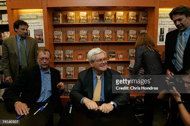 Former Speaker of the House Newt Gingrich prepares to sign his book "Pearl Harbor: A Novel of December 8th" along with co-author William Forstchen at...