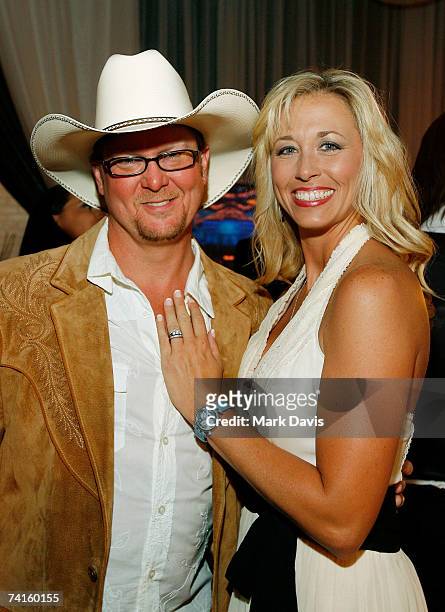 Country artists Tracy Lawrence and wife Becca Lawrence pose in the Distinctive Assets gift lounge during the Academy of Country Music Awards held at...