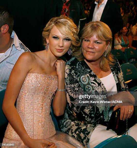 Musician Taylor Swift and her mother Andrea Finlay pose in the audience during the 42nd Annual Academy Of Country Music Awards held at the MGM Grand...