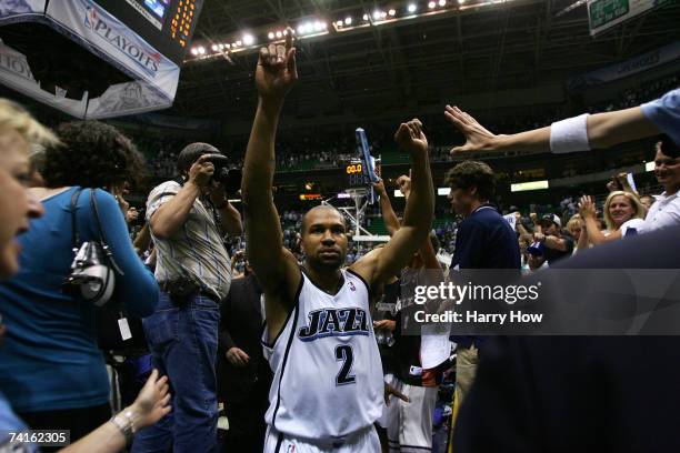 Derek Fisher of the Utah Jazz celebrates a 100-87 win over the Golden State Warriors after the fourth quarter in Game Five of the Western Conference...