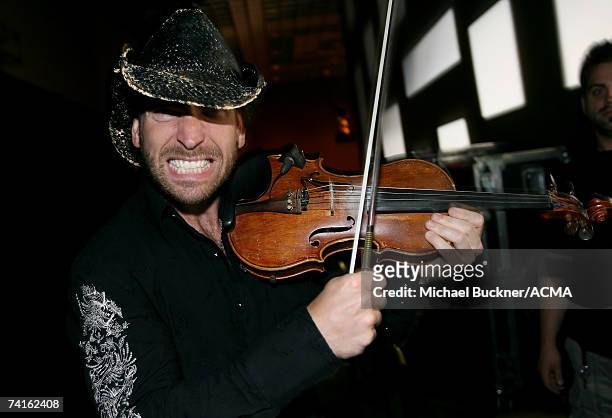 Musician David Pichette of the band "Emerson Drive" prepares backstage at the 42nd Annual Academy Of Country Music Awards All-Star Jam held at the...