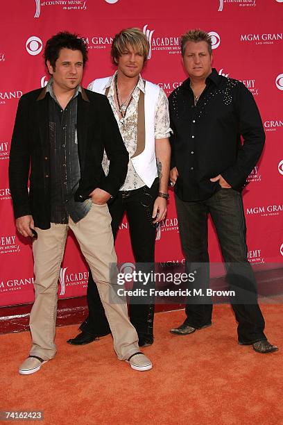 Musicians Jay DeMarcus, Joe Don Rooney, and Gary LeVox from the band "Rascal Flatts" arrive at the 42nd Annual Academy Of Country Music Awards held...