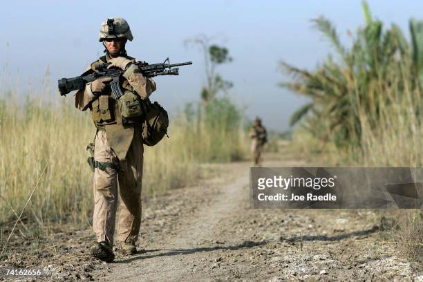 Marine HN Tony Venenzia from Denver, Colorado of Mobile Assault Platoon 3 of Weapons Company 2 battalion, 7th Marines during a security patrol May...