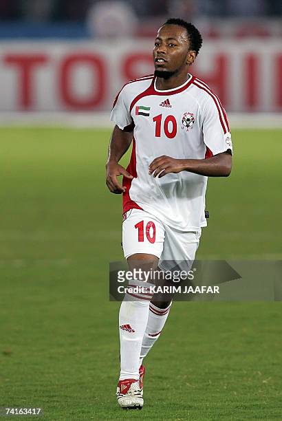 Abu Dhabi, UNITED ARAB EMIRATES: Emirati national football team player Ismail Matar runs in the field during the 18th Gulf Cup championship football...