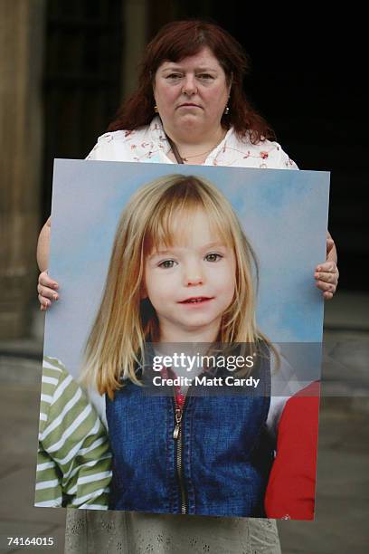 Phil McCann carries a picture of her missing niece Madeleine McCann as she visits Parliament on May 16, 2007 in London. Madeleine McCann disappeared...