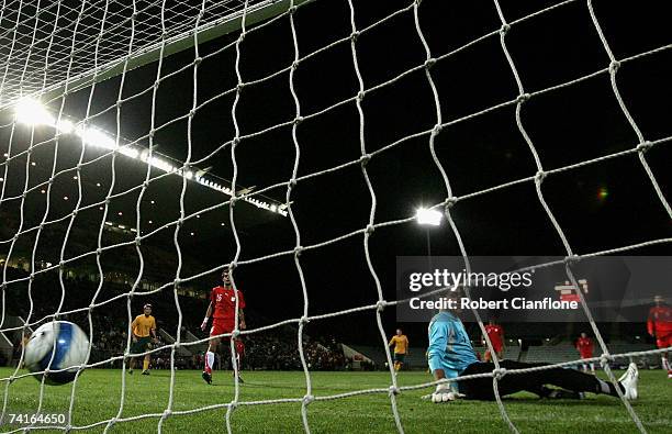 Soush Makani goalkeeper of Iran can only watch as he is beaten by a shot from James Troisi of Australia during the Olympic Games qualifying match...