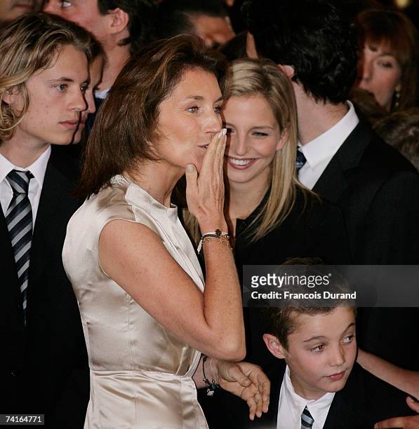 Cecilia Sarkozy blows a kiss to her husband Nicolas Sarkozy as she looks after their children; Pierre, Judith and Louis at the Elysee Palace on May...