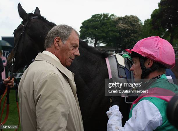 Trainer Henry Cecil chats to jockey Richard Hughes after he and Passage Of Time landed The Tattersalls Musidora Stakes Race run at York Racecourse on...