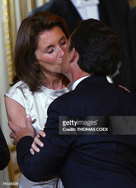 Nicolas Sarkozy kisses his wife Cecilia before being officially invested as France's president, 16 May 2007 at the Elysee Palace in Paris. Sarkozy, a...